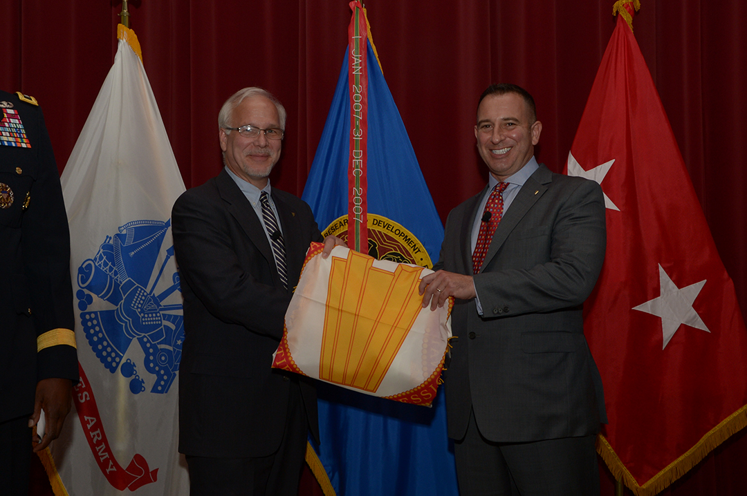 On Nov. 10, the U.S. Army Edgewood Chemical Biological Center (ECBC) held a combined Senior Executive Service (SES) and Senior Research Scientist (ST) ceremony at the Conference Center on the Edgewood area of Aberdeen Proving Ground, Md. Newly appointed Senior Research Scientist for Bioengineering, Peter Emanuel, Ph.D., receives his ST flag.