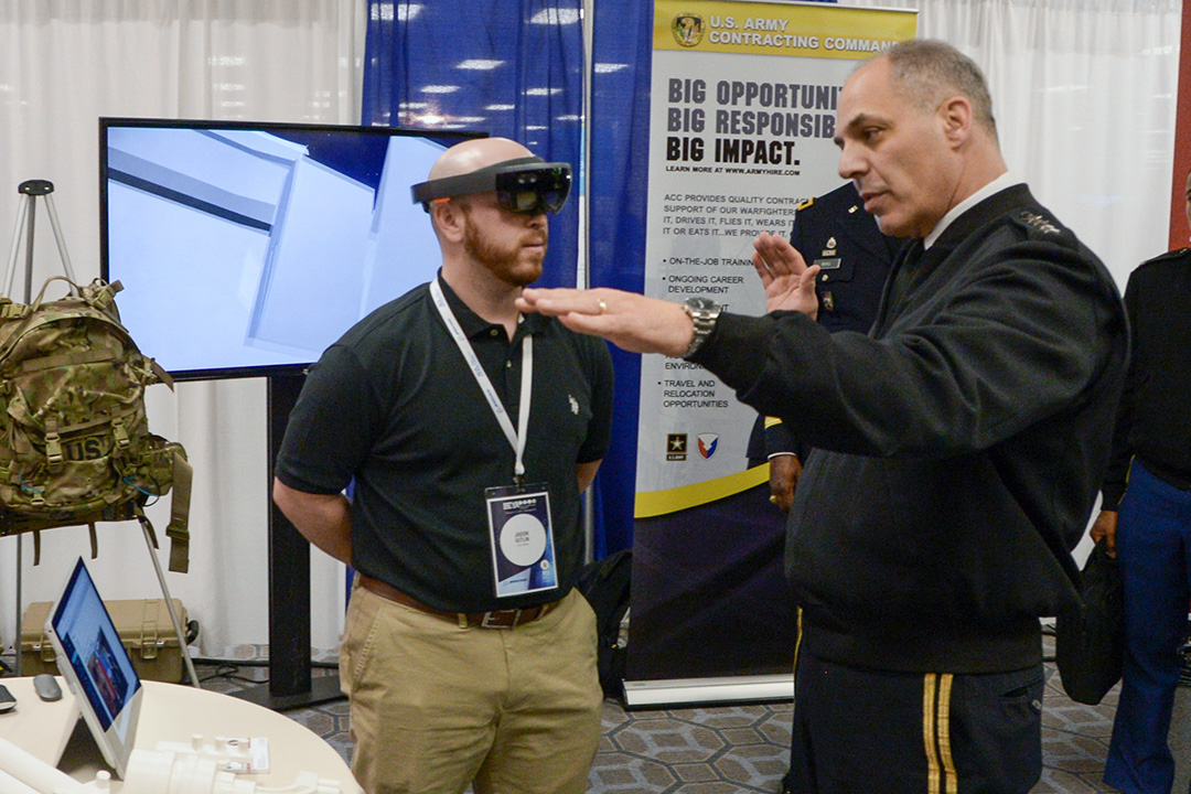 Gen. Gustave Perna, commanding general of the U.S. Army Materiel Command, discusses an augmented reality prototype that ECBC’s Advanced Design and Manufacturing team is adapting for military use with Animation Team Lead Jason Gitlin.