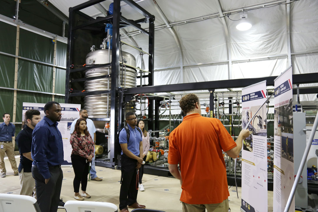 MUSIP students learn about the Field Deployable Hydrolysis System, which RDECOM C&B used to destroy 600 tons of Syrian chemical warfare material at sea in 2014.