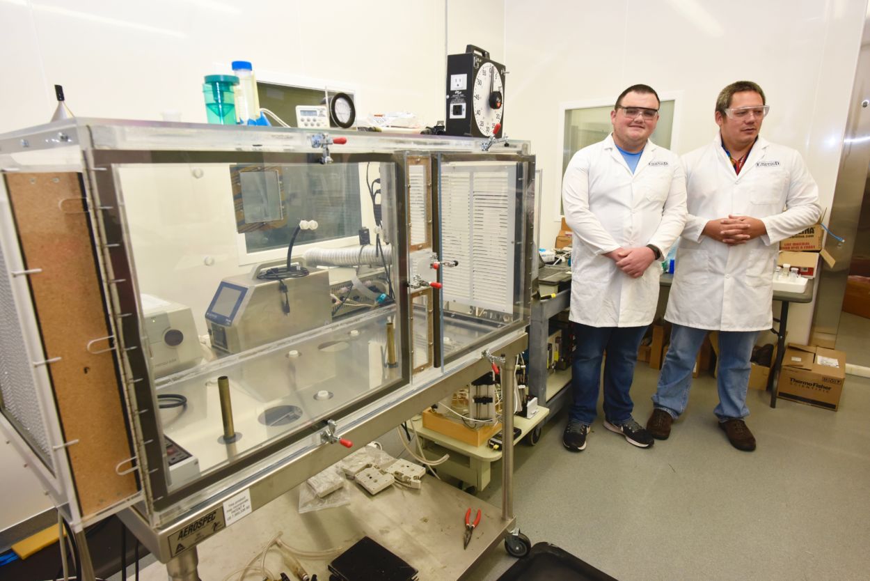 Tyler Dufrene (left) and Jerry Cabalo, Ph.D., (right) in the lab.