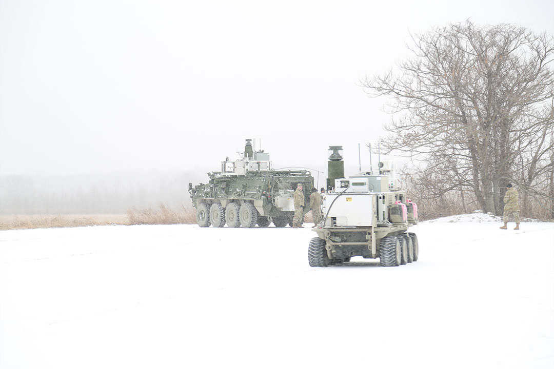 An NBCRV and UGV, outfitted with the new chemical detection sensor package, are positioned for the demonstration. (Photo credit: CCDC Chemical Biological Center photo by Shawn Nesaw)
