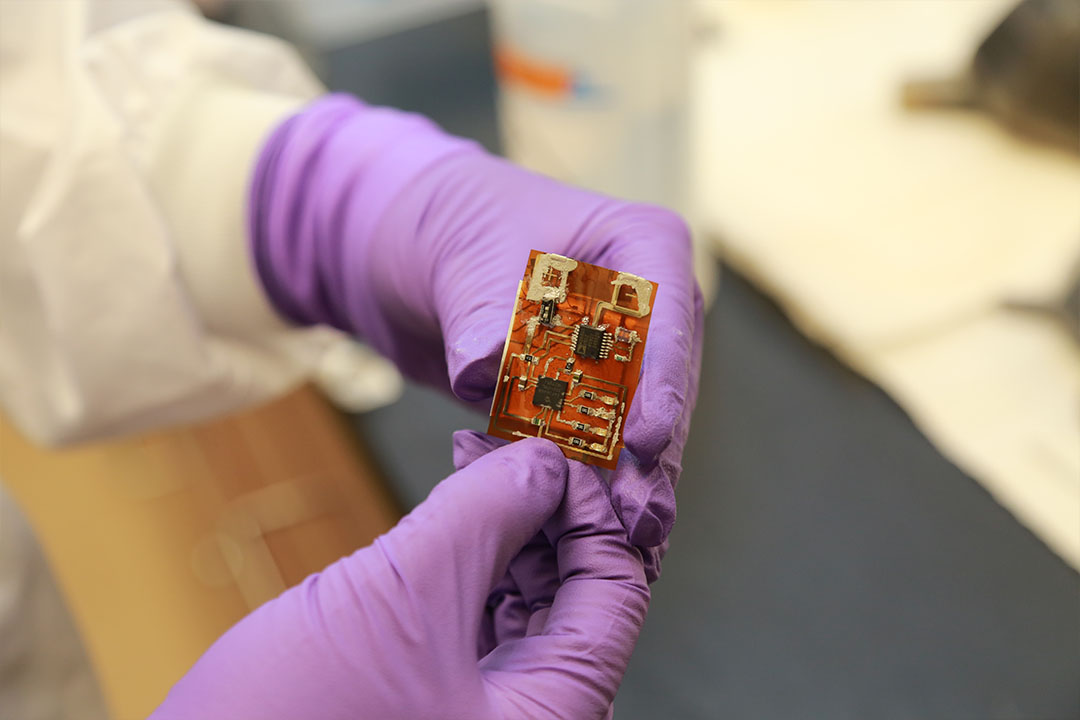 Self-indicating colorimetric response materials can be embedded into objects such as this microchip to instantly alert warfighters to contaminated items. (Photo credit: CCDC Chemical Biological Center photo by Shawn Nesaw)