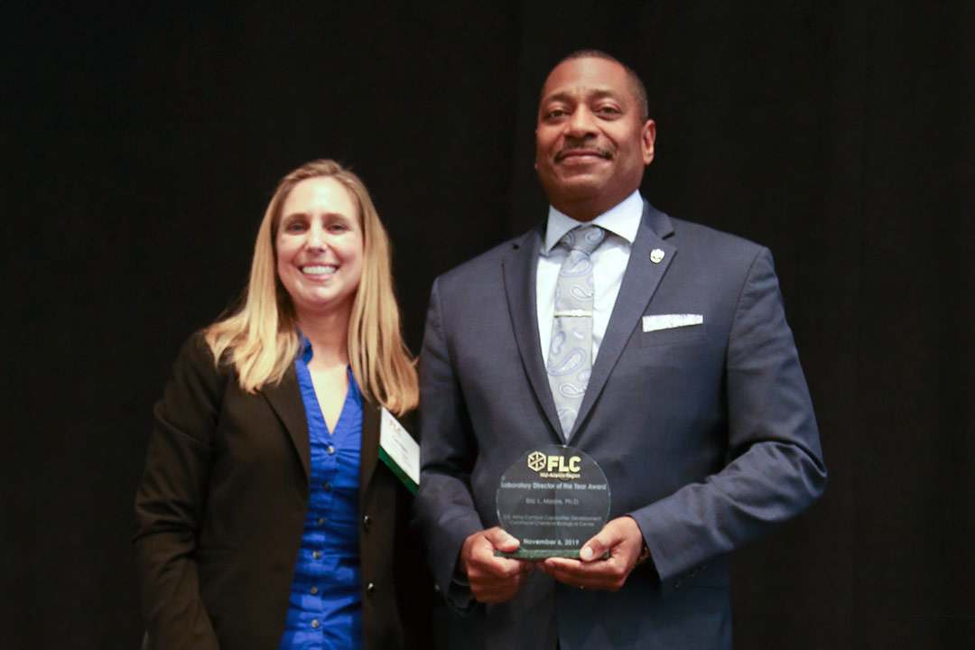 Pictured are Carmen Krieger, FLC Mid-Atlantic Deputy Regional Coordinator and Eric L. Moore, Ph.D., Director, CCDC Chemical Biological Center.