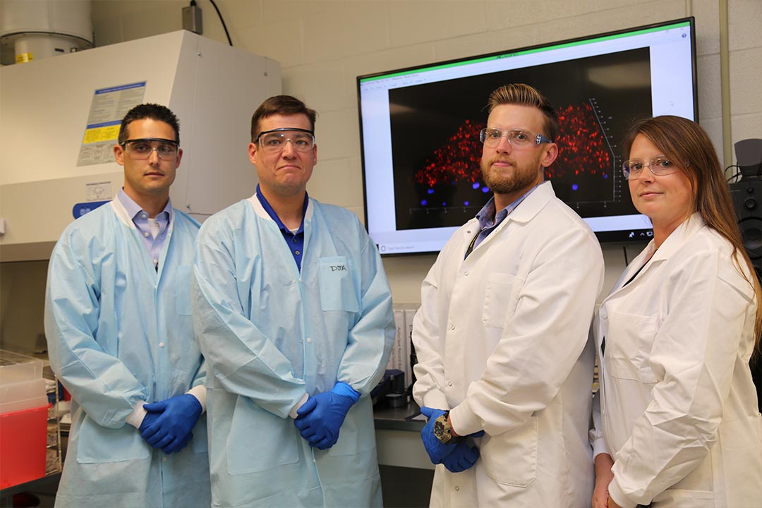 The MPS-RTA research team (left to right): Kyle Glover, Ph.D., Molecular Toxicology Branch chief; Dan Angelini, Ph.D., research biologist; Tyler Goralski, Ph.D., research biologist; Jen Horsmon, Ph.D., biologist. Not pictured are Jennifer Sekowski, Ph.D.; Trevor Glaros, Ph.D.; Elizabeth Dhummakupt, Ph.D.; Phil Mach, Ph.D.; Russ Dorsey, Ph.D. and Erin Gallagher, Ph.D.