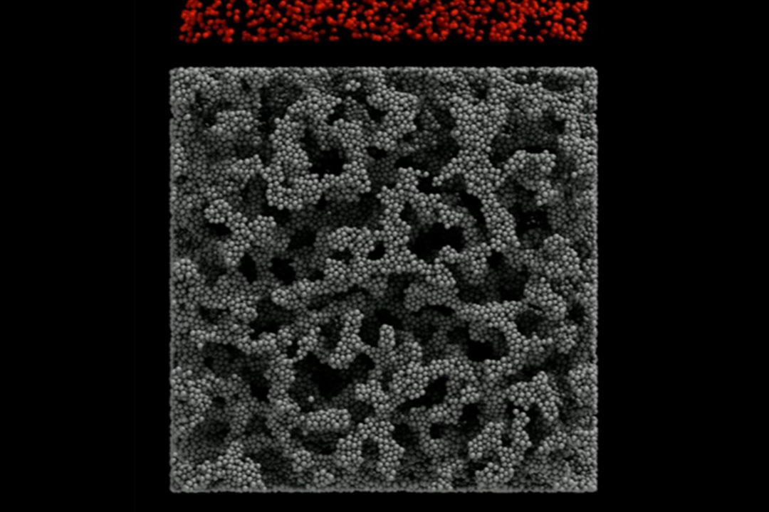 During the simulation, the particles are tracked as they move through the pore network (3D printed material) to arrive at the opposite of the simulation box. (Image provided by Stanford University.