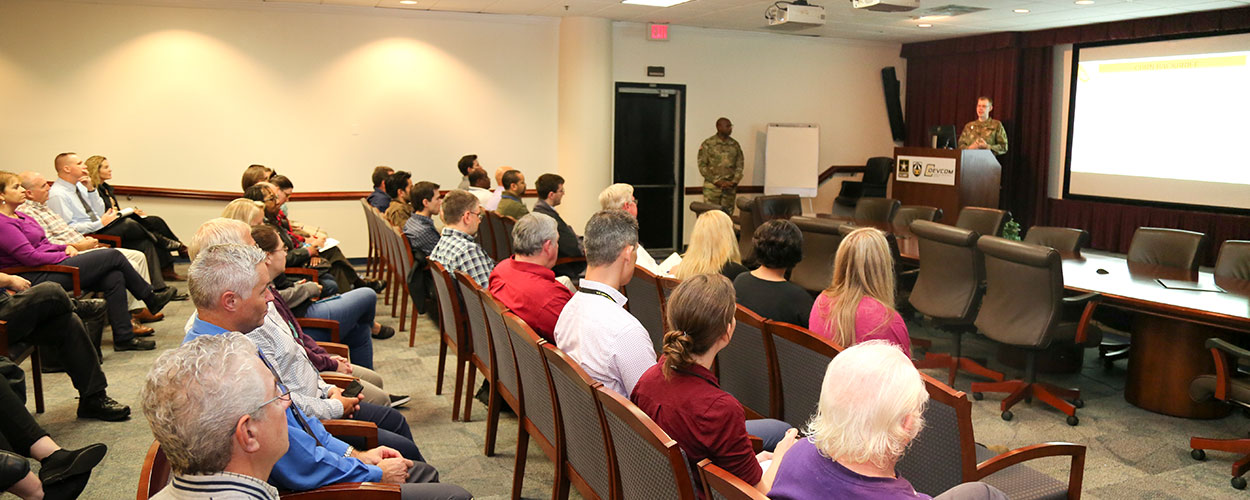 Capt. Matthew Grout and Master Sgt. John Binot took time to present operational information from the field to the Center’s workforce in an effort to increase transparency for researchers.