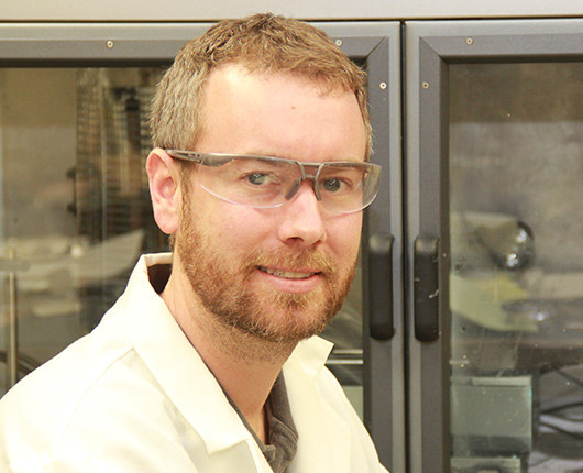 Research chemical engineer Gregory Peterson works to combine MOFs with polymers to make decontaminating textiles to protect warfighters.