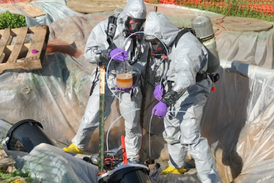 Chemical biological operations personnel from the Center’s Chemical Biological Application and Risk Reduction unit conduct a Level-B sampling mission at the site of a discovered underground storage tank on Aberdeen Proving Ground South.