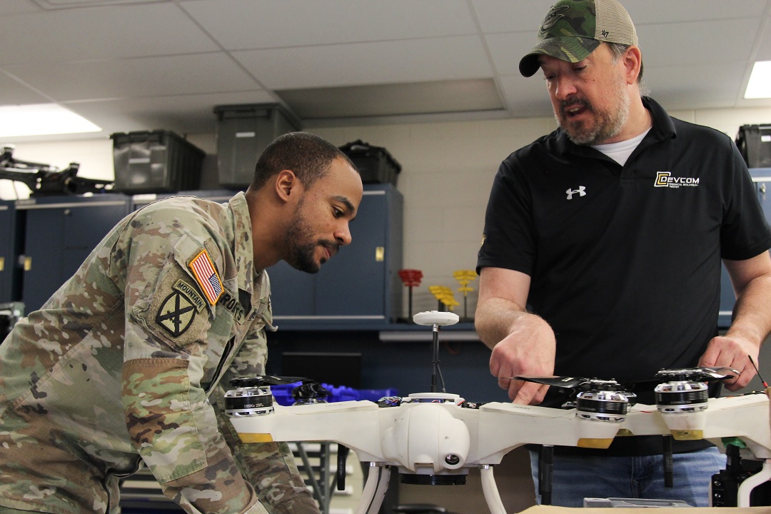 Sergeant First Class Johnny Roberts learns about the Center’s Array Configured of Remote Network Sensors interface for military unmanned aerial vehicles from Mike Mays, Robotics Integration Team Lead at the Advanced Design and Manufacturing lab. (U.S. Army photo by Ellie White).