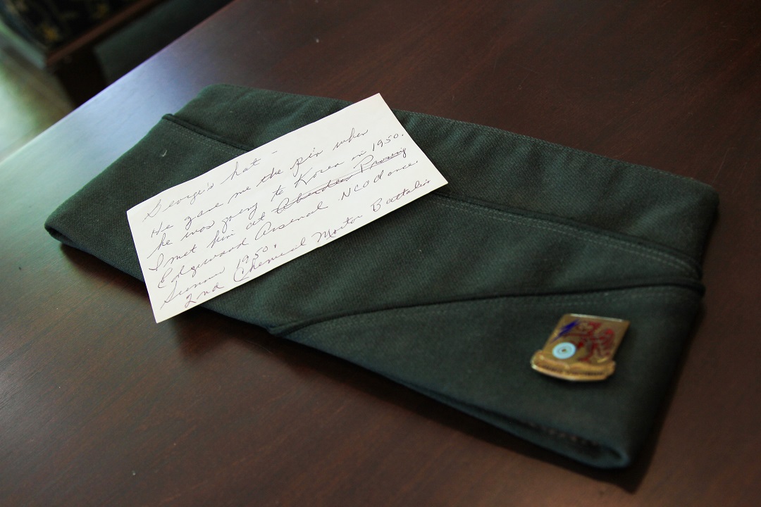 Cecilia Lesser shared a memento of her late husband’s military hat, which is still adorned with the pin he left her with upon his deployment to Korea in 1950. (U.S. Army photo by Ellie White)