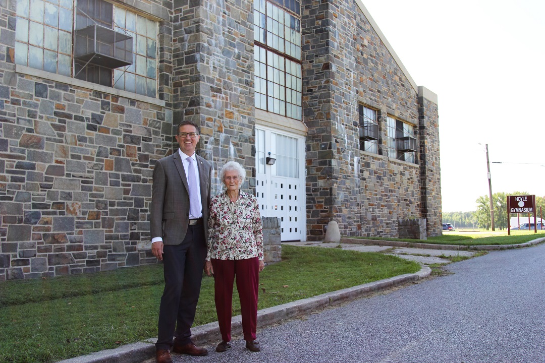 DEVCOM CBC Director Michael Bailey and Cecilia Lesser stop at Hoyle Gym to re-visit the same building where Lesser met her late husband in 1950. (U.S. Army photo by Ellie White)
