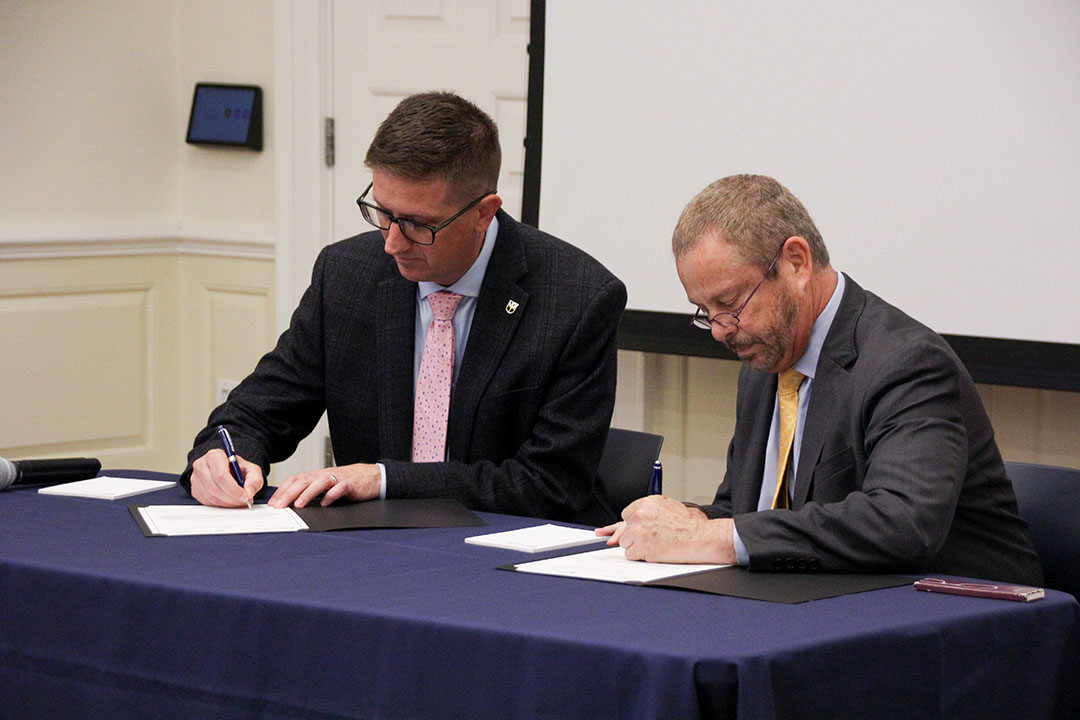 Mr. Michael Bailey, DEVCOM CBC Director, and Ed Schlesinger, Benjamin T. Rome Dean at Johns Hopkins Whiting School of Engineering, complete the establishment of an EPA during a signing ceremony at the JHU campus in Baltimore, MD on September 11, 2023. (U.S. Army photo by Ellie White)